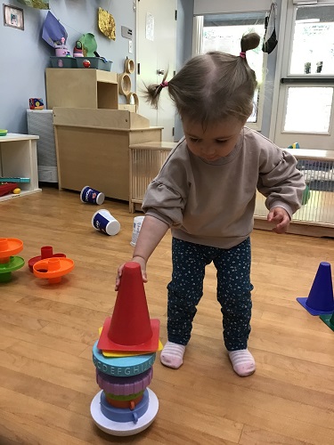 Child stacking objects