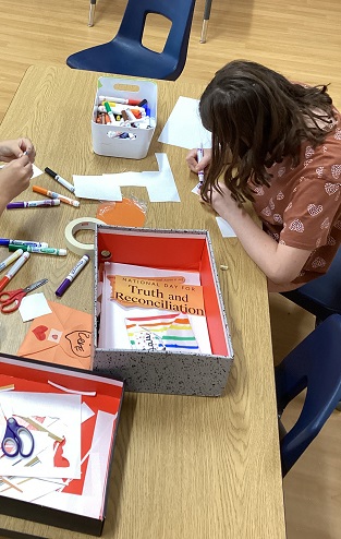 School age children working on their truth and reconciliation learning