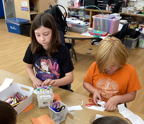 School age children working on their truth and reconciliation learning