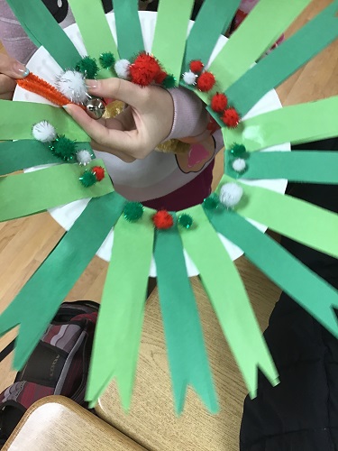 Child's completed paper wreath