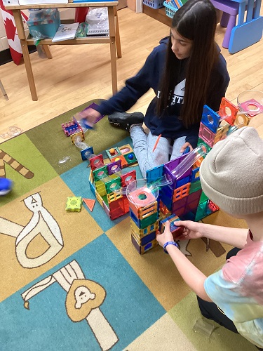 Working together to build the marble track