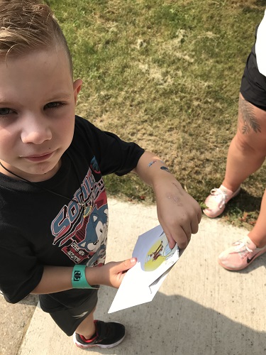 A child opening an envelope 