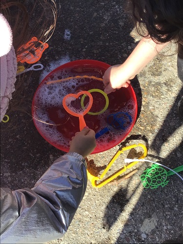 Bubble wands in a bowl of bubble solution