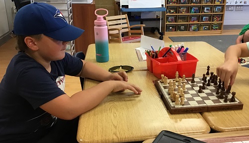 Two children playing chess