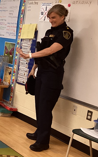 Image of the Police Officer waving 