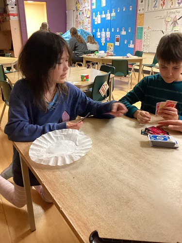 children playing Uno Flip