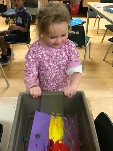 JKK girl creating a marble paint masterpiece 