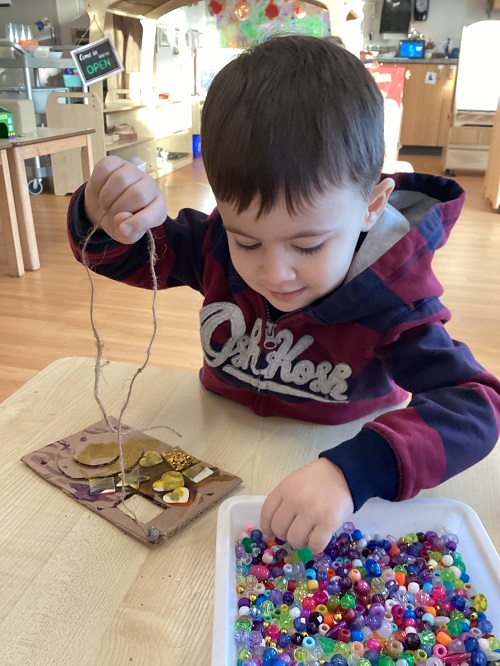 A child decorating the camera they created