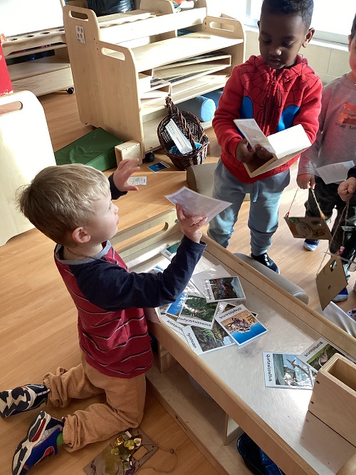 Children showing Polaroids to each other