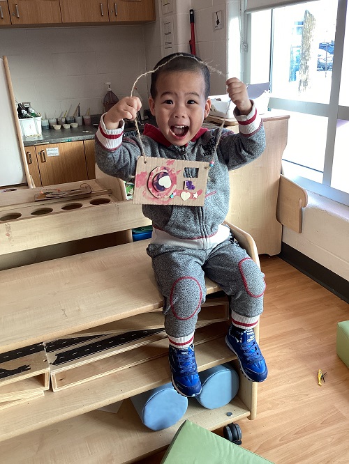 A child showing their camera