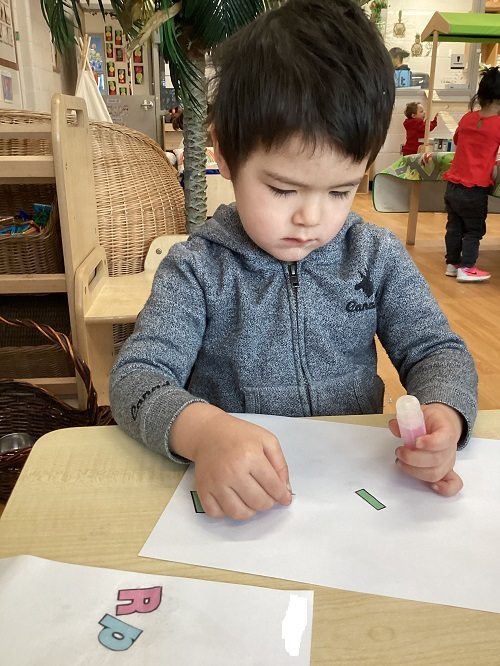 A child exploring with letters.