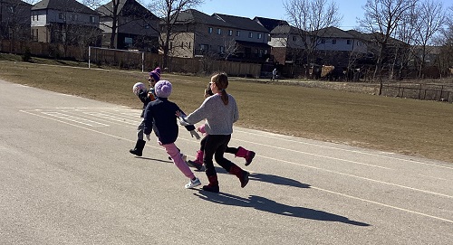A group of children playing a ball game.