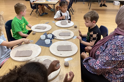 A group of children working with clay.
