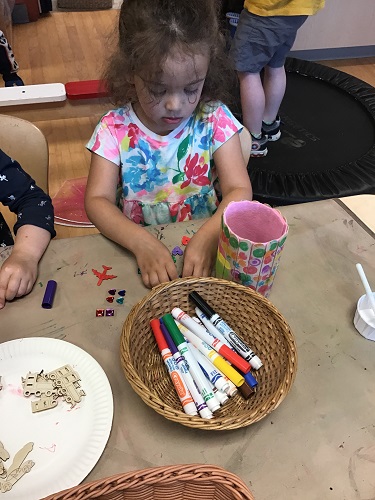 Children creating a father's day gift