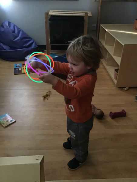 child holding a glowing ball form