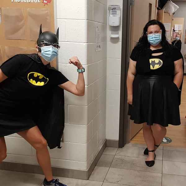two educators dressed as bat girl