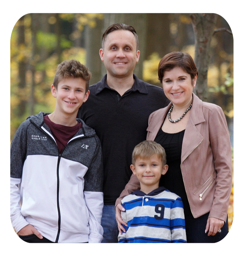 Julia's family outdoors in the fall