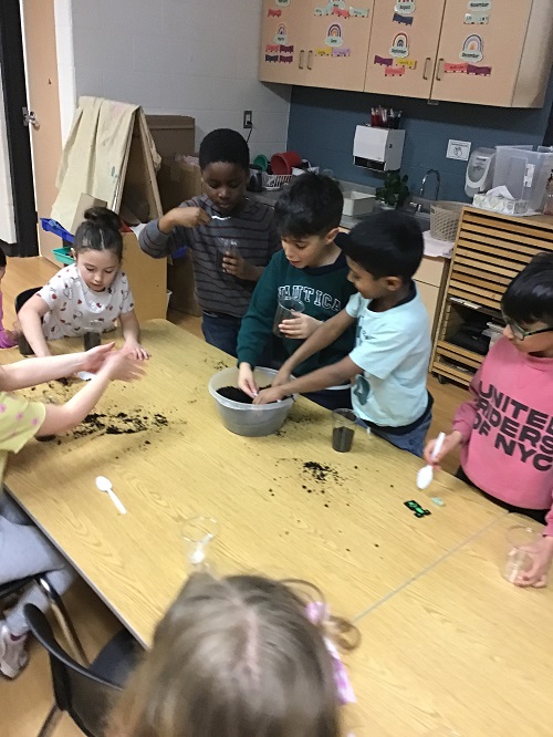children planting seeds