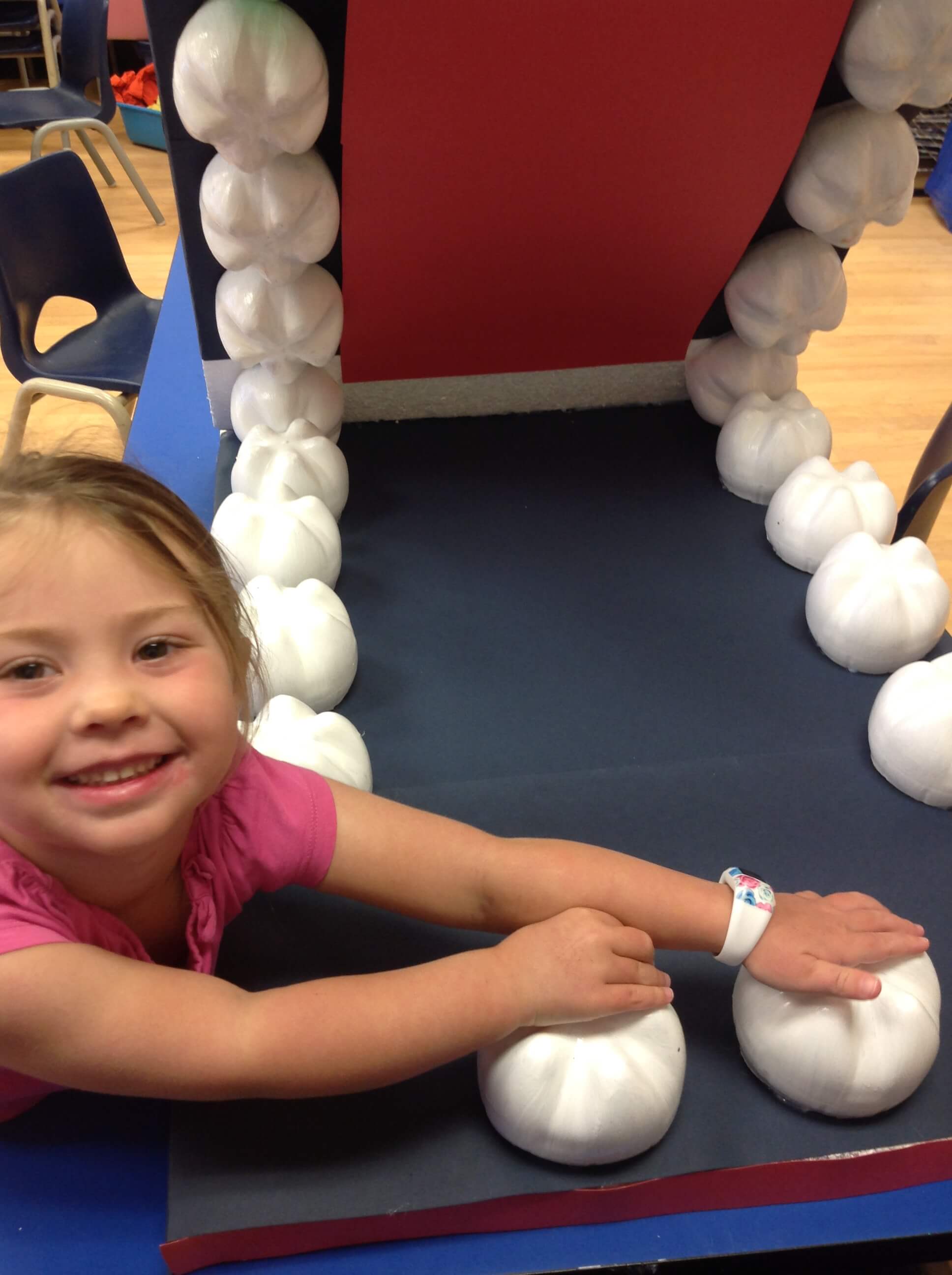 girl standing with handmade mouth