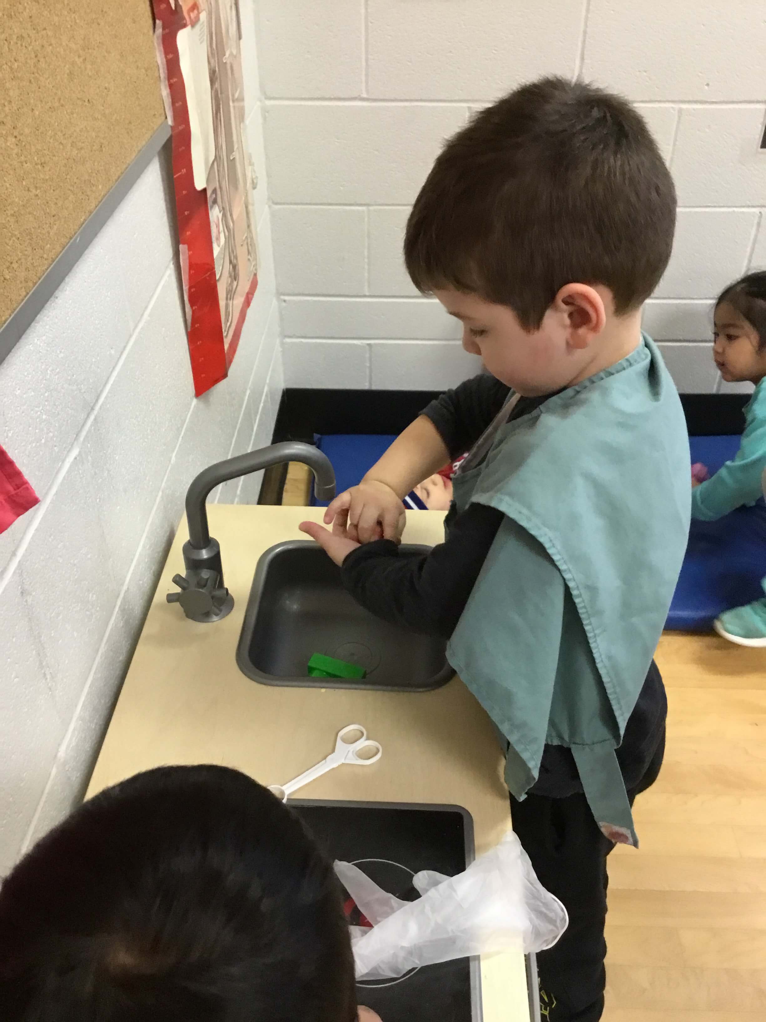 play doctor washing his hands