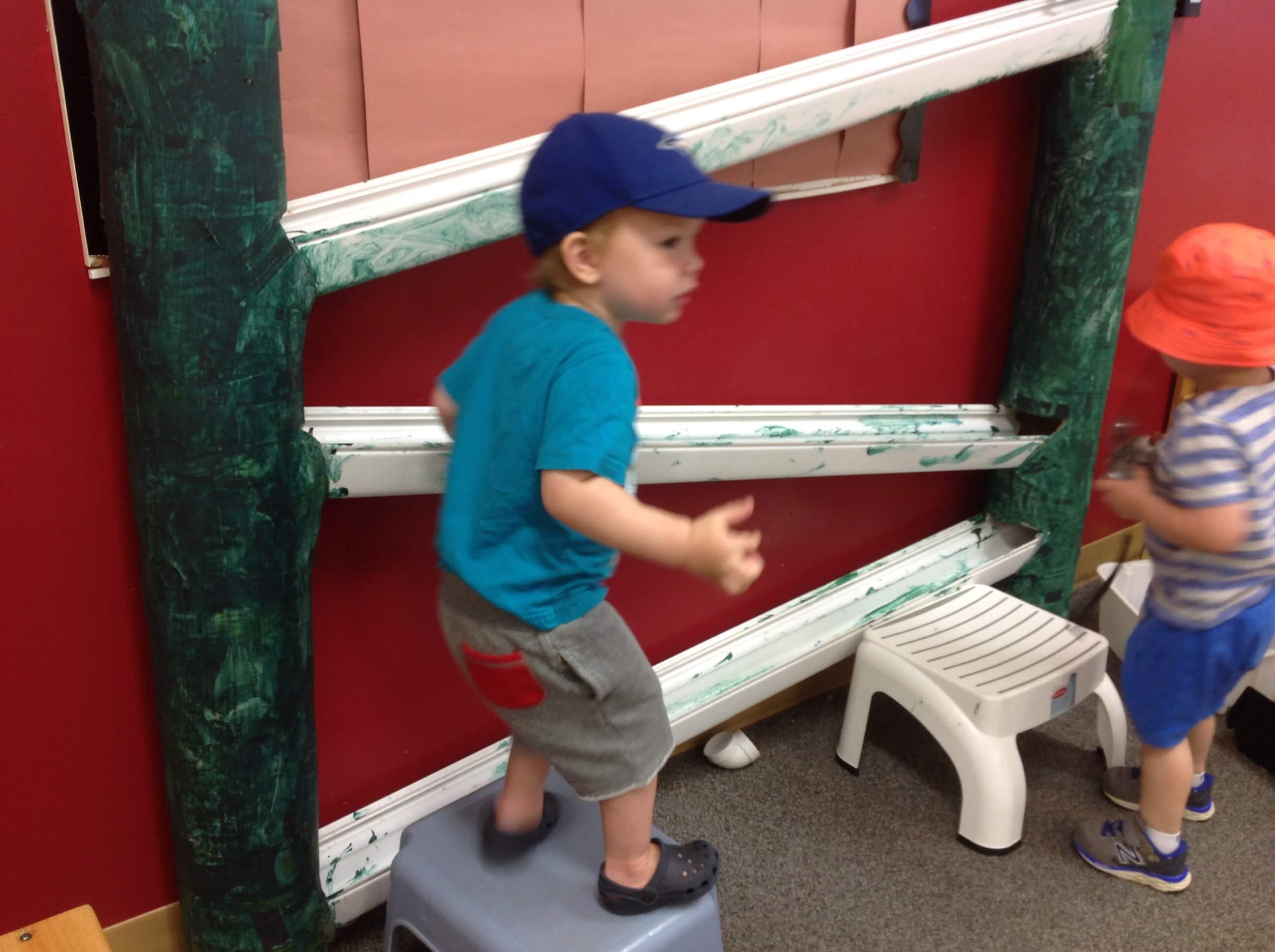 children about to stand on a stool