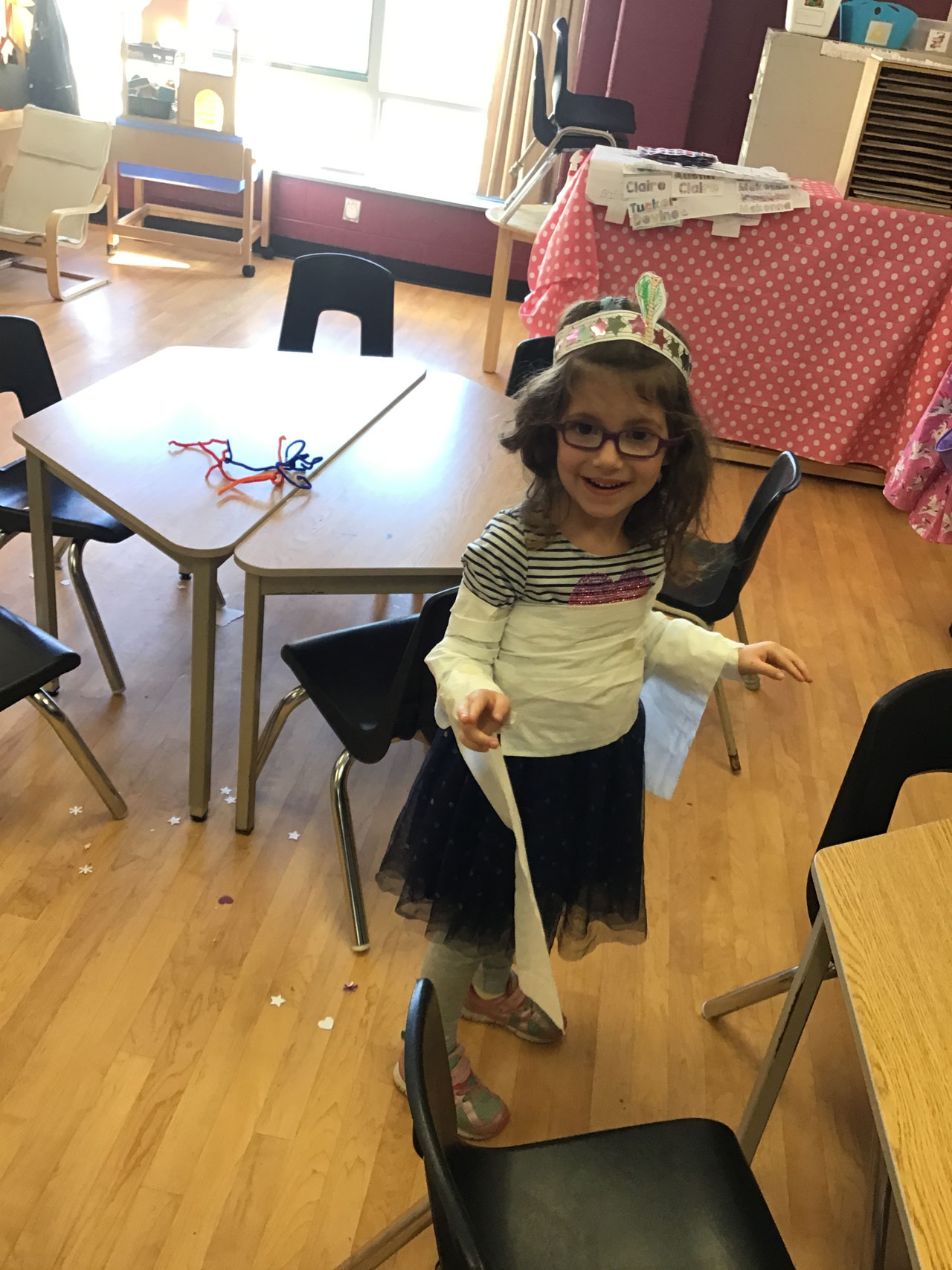 girl wrapped in toilet paper, looking like a mummy