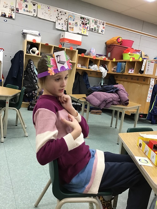 Child thinking before guessing what picture they have.