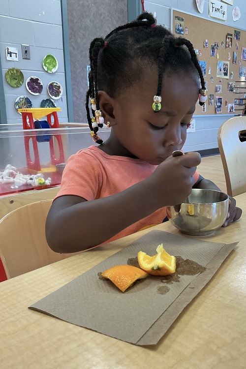 Child eating their snack.