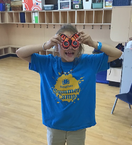 child wearing butterfly sunglasses