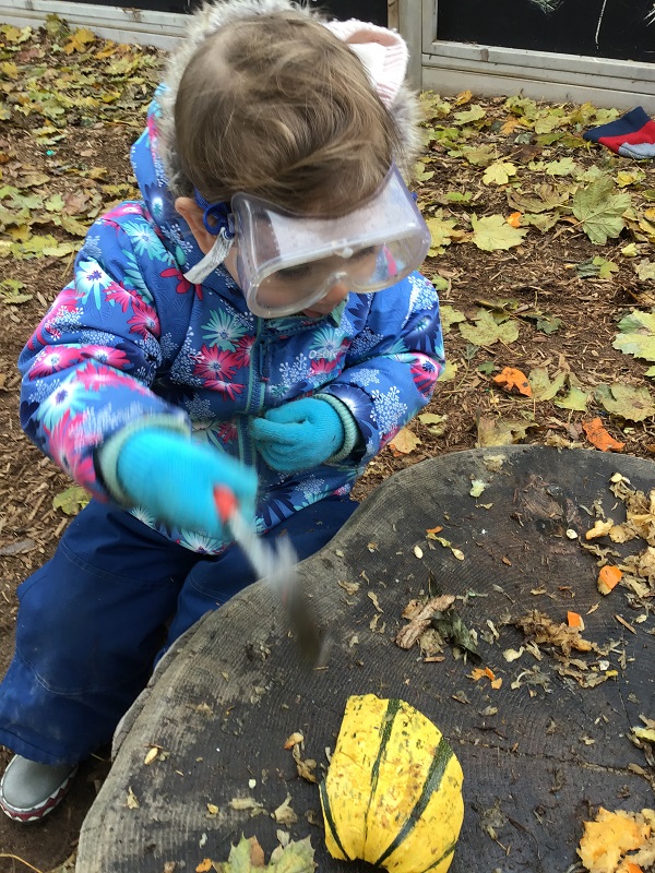 Child exploring with tools