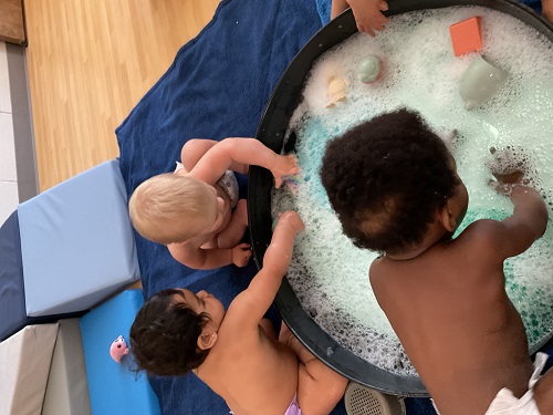 a group of children exploring water