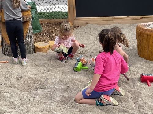 group of children in the sand play area