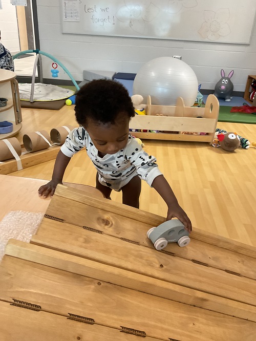 child with car on ranp