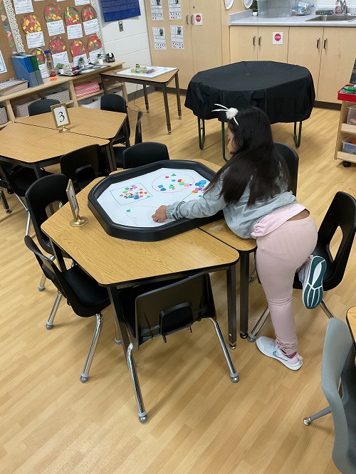 child at the tuff tray