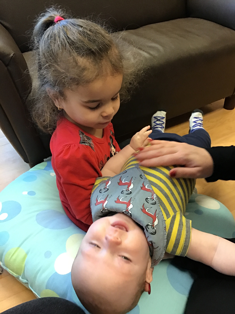 child holding a baby